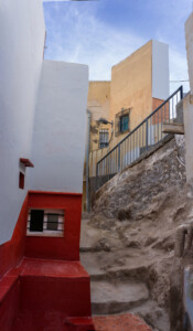 Red wall and stone staircase