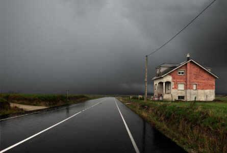 House and road in Asturias. 2003 Spain